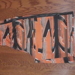 Under Armour Shorts. Orange/Gray Patterned with Pockets. Youth Large.